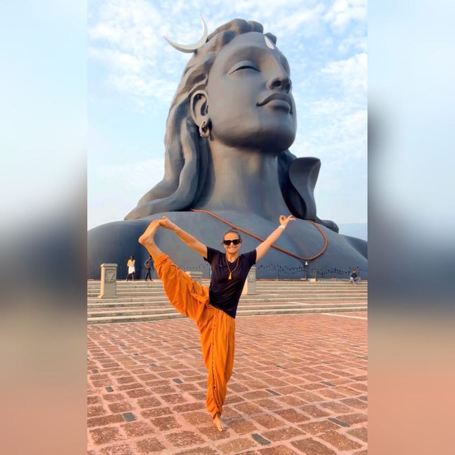 Aastha Chopra in Extended hand to big toe before Adiyogi (Utthita Hasta Padangusthasana), Isha, Coimbatore, India, March 2023