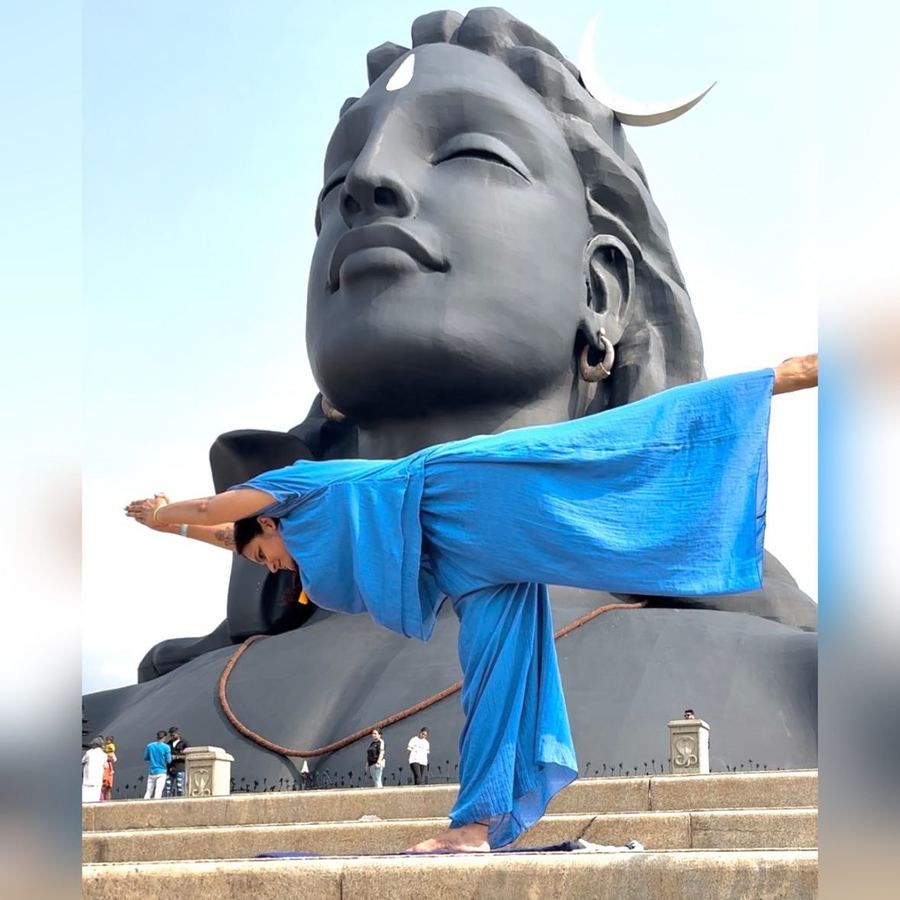 Aastha Chopra in Warrior three before Adiyogi (Virabhadrasana III), Isha, Coimbatore, India, April 2023