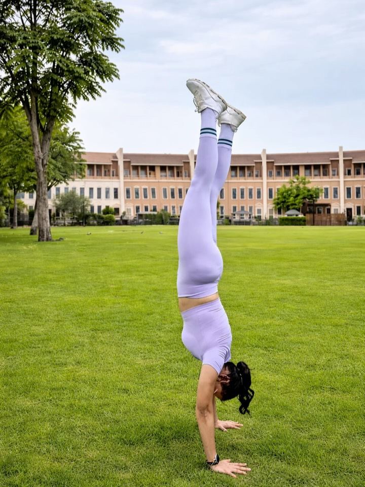 Aastha Chopra in Handstand on the lawn (Adho Mukha Vrksasana), Dubai, April 2026
