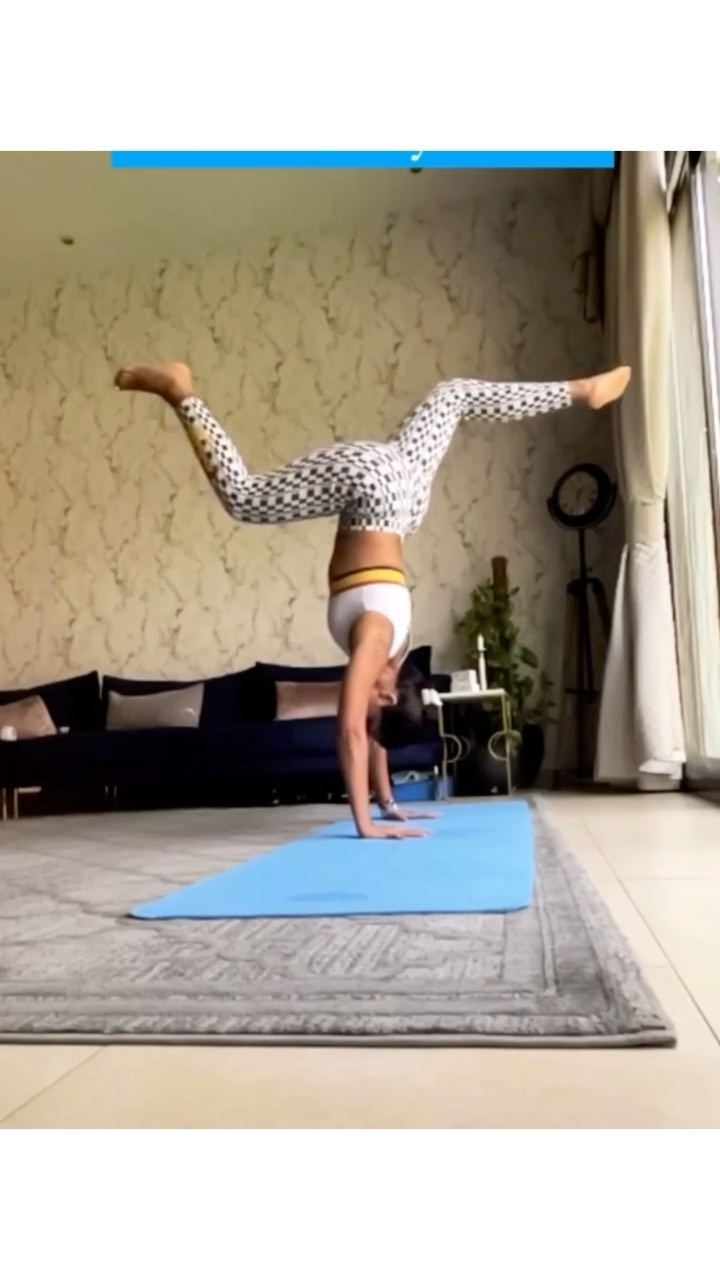 Aastha Chopra in Straddle handstand (Adho Mukha Vrksasana), Living room, Dubai, February 2022